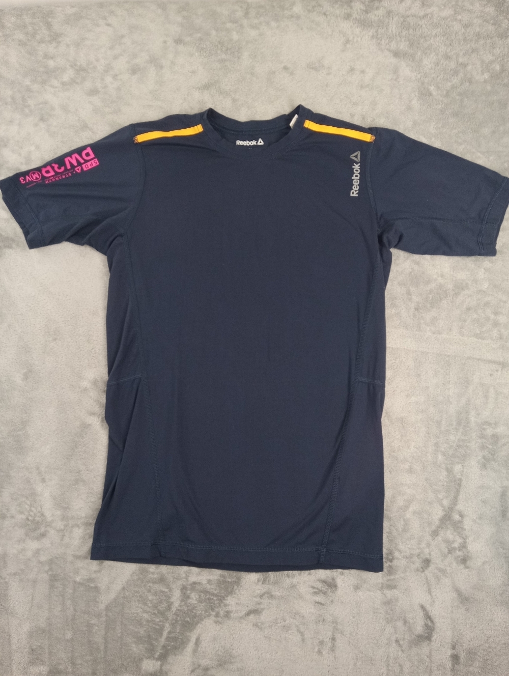 Reebok Youth Size XL Navy Athletic T-Shirt with Yellow Accents.